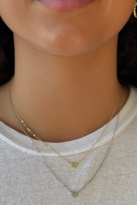 TINY STAR OF DAVID NECKLACE - STERLING SILVER