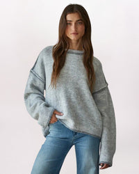 EXPOSED SEAMS ROLL EDGE SWEATER